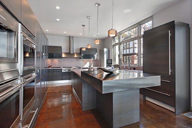 High-end apartment kitchen with island and stainless steel appliances